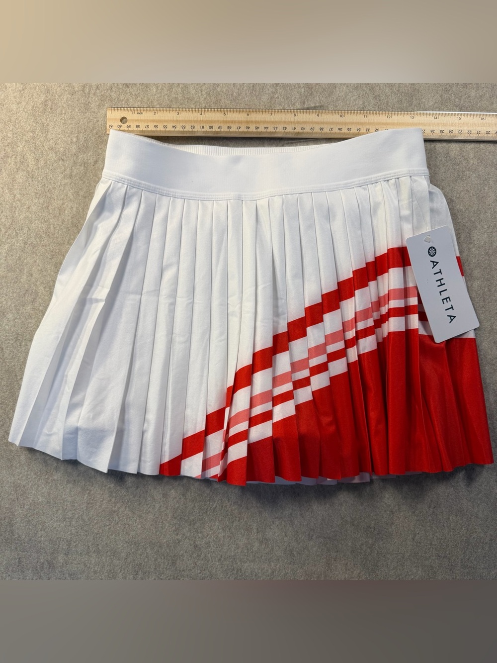 Athleta White Pleated Mini Skirt with Red Diagonal Stripe. New with Tags